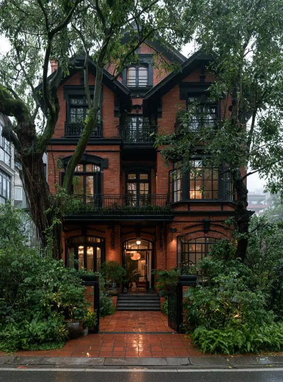 46 Red Brick House With Black Trim Ideas for Standout Curb Appeal 42 Red brick house with black trim, black iron balconies, and arched windows at dusk