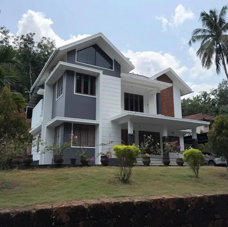 Modern Grey and White House Exterior: 30 Two-Tone Ideas 11 Two-story modern grey and white house exterior with charcoal walls, white trim bands, and a brick accent panel