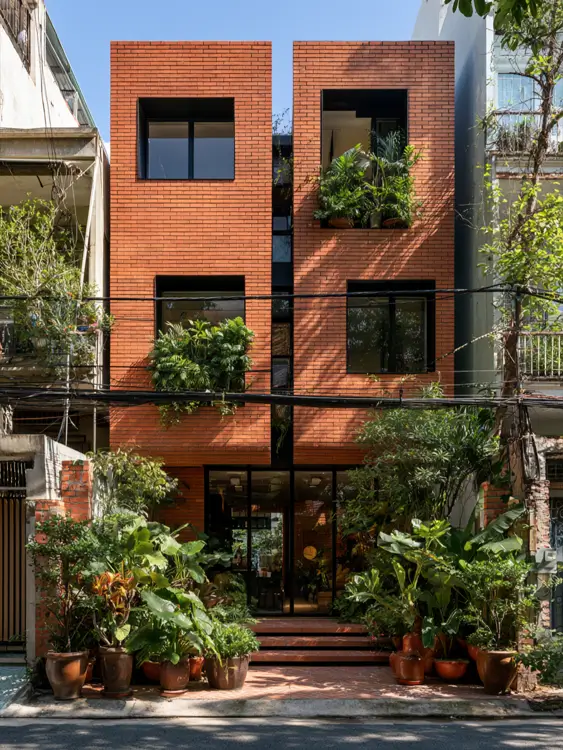46 Red Brick House With Black Trim Ideas for Standout Curb Appeal 11 Modern red brick house with black trim and deeply recessed black windows
