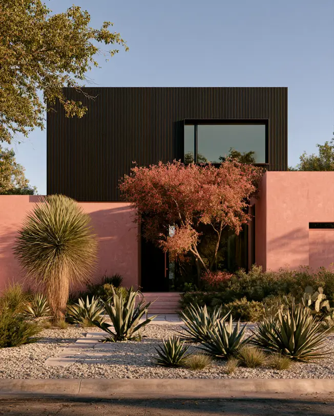 26 Black and Pink Houses Worth Saving Before You Paint 18 Black and pink house exterior on a desert modern home, with a dusty pink stucco wall and a black slatted-timber box