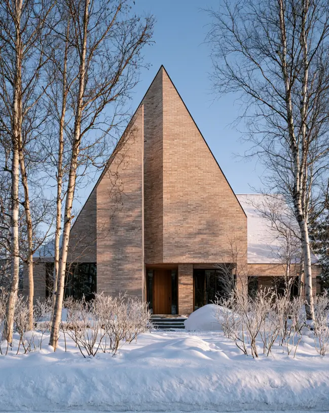 Blonde Brick House Ideas: 24 Warm Exteriors That Still Feel Fresh 18 Modern blonde brick house with a steep triangular gable clad in slim sandy brick and a warm wood front door